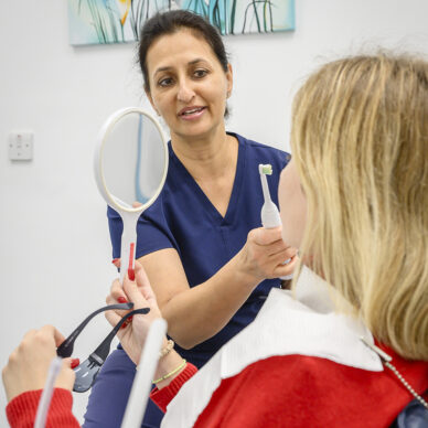 Hygienist treating a patient at Harley Street Orthodontics