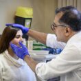 maxillofacial consultant Professor Kaveh Shakib with patient